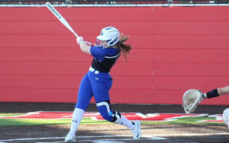 (TC GORDON | THE GRAHAM LEADER) Graham’s Zoey Harrell connects on a pitch with a strong follow-through during the team’s 9-1 win Monday, March 11 against Stamford. The Lady Blues traveled to Burkburnett the next day but took a loss 8-7.