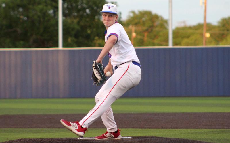 (TC GORDON | THE GRAHAM LEADER) Junior Mason Milton works through his windup and fires a pitch home during Graham’s 6-2 loss against Glen Rose last Friday, April 12. Milton pitched 2 1/3 innings before exiting the game with an injury after getting hit by a comebacker on his throwing arm.