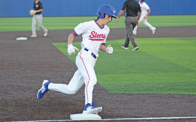(TC GORDON | THE GRAHAM LEADER) Graham junior Levi Jilek rounds third base and heads for home to score a run during the Steers’ game against Mineral Wells this past Tuesday, March 19. The Steers beat the Rams 4-3 and moved to 2-2 in district.