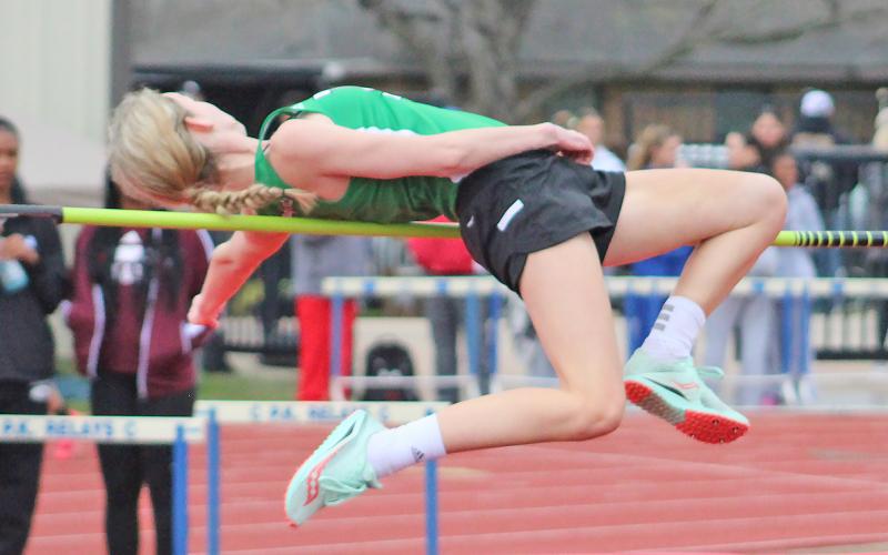 (TC GORDON | THE GRAHAM LEADER) Newcastle’s Aubree Clayton completes one of her high jump attempts during the PK Relays held in Graham last Saturday, March 16. Clayton’s event was one of the few that finished before the meet was canceled due to heavy rainstorms.