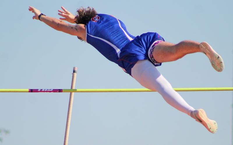 (TC GORDON | THE GRAHAM LEADER) Graham’s Rylan Monsey clears the bar during one of his pole vault attempts at the Pojo Relays in Springtown last Saturday, March 23. Monsey earned a first place medal in the event with a jump of 13-00.