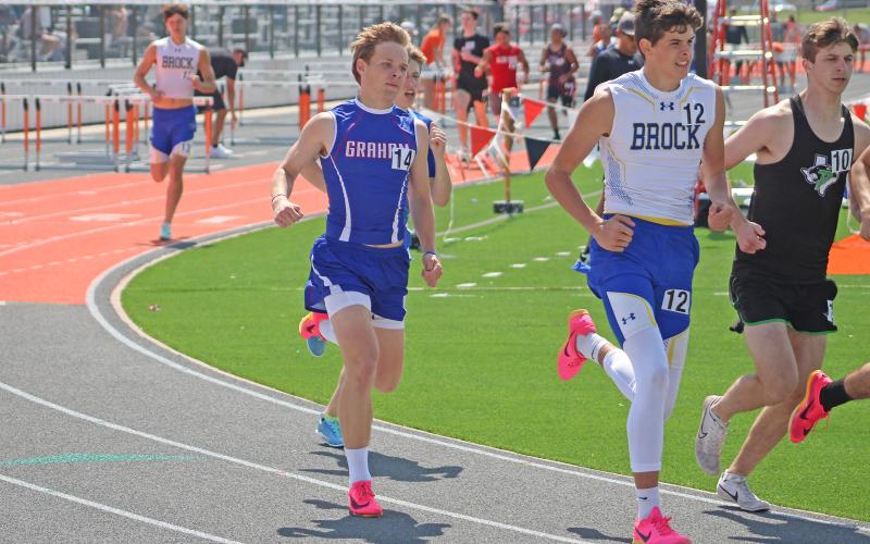 (TC GORDON | THE GRAHAM LEADER) Graham senior Holton Weatherman keeps up with the pack during the 800-meter Run event at the Pojo Relays in Springtown last Saturday, March 23.