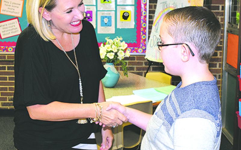 Susan Riley welcomes Aidan Adams to her fifth grade English Language Arts class at Woodland Elementary School during Meet the Teacher events held Thursday afternoon and evening at Graham ISD schools. (Leader photos by Cheryl Adams)