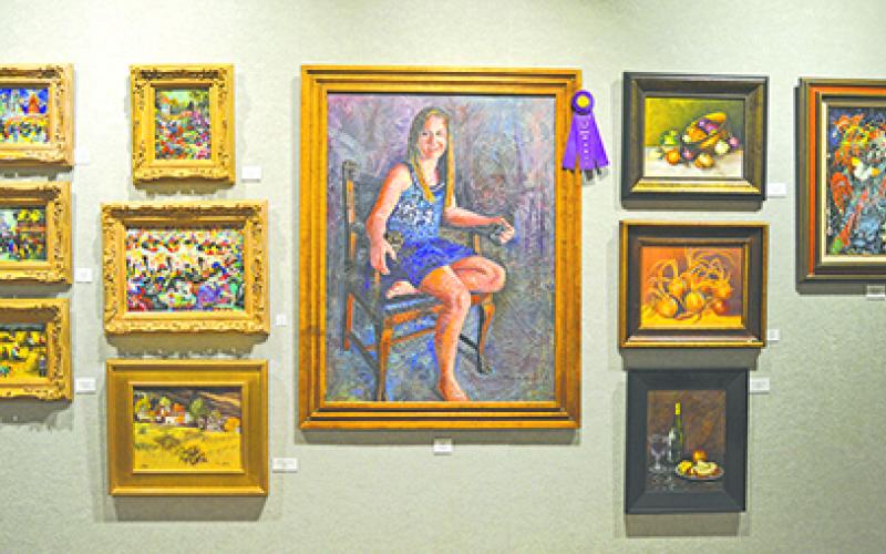 The artwork named Best of Show  in the annual Lake Country Art Show is Sierra, an oil painting by Colleen Erickson, shown at center. (Leader photo by Thomas Wallner)