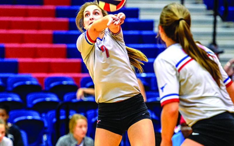 Baylee Loomis finished with four blocks in the Blues’ win over Windthorst Tuesday. Loomis, Emily Davis (pictured) and Skylar Morris each had four blocks in the win, and Loomis led the team with four aces.  Leader photo by David Flynn