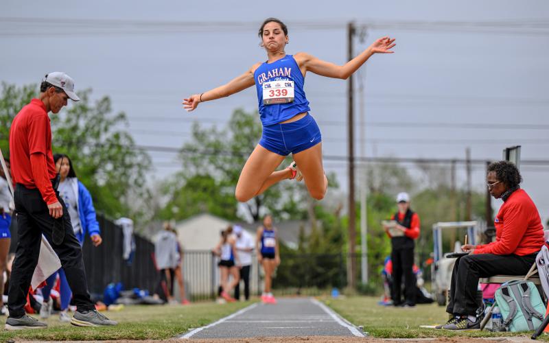 (DAVID FLYNN | CONTRIBUTED PHOTO) Georgia Martin flies through the air during one of her long jump attempts at the Region 1-4A track meet in Lubbock last weekend. Martin finished fifth in the event.