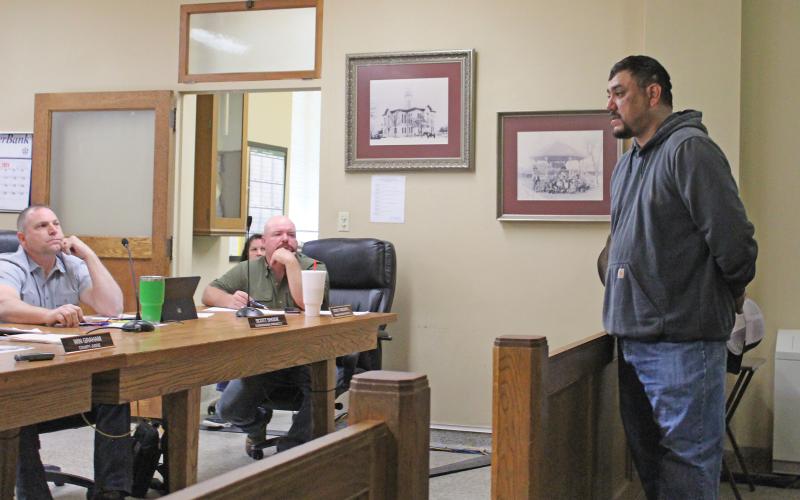 (TC GORDON | THE GRAHAM LEADER) Newcastle mayor Adrian Ontiveroz presents an issue about a damaged bridge affecting some of the town’s citizens to the Young County Commissioners Court at their meeting Monday, April 22. The city is looking for help in repairing the worn down bridge.