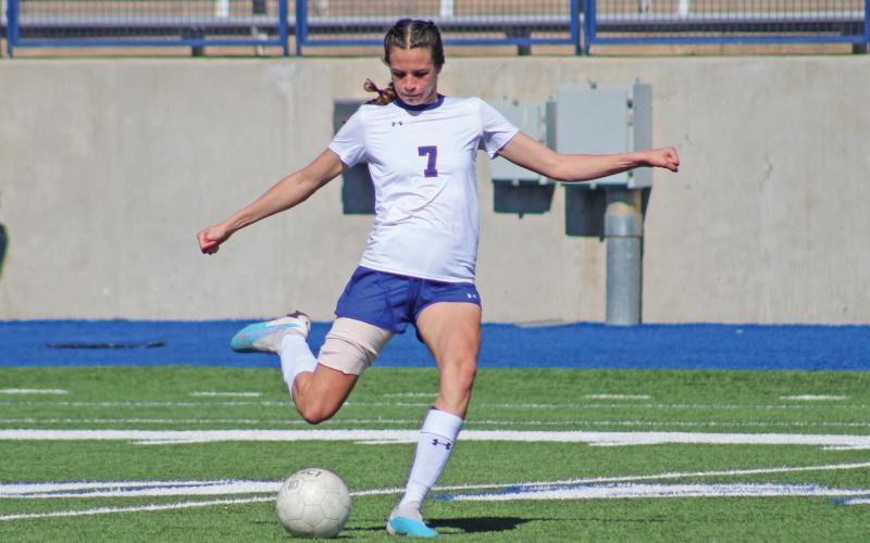 (TC GORDON | THE GRAHAM LEADER) Senior Sophia Schlieper boots the ball far up the field during Graham’s area playoff game against San Elizario. The Lady Blues finished second in district this year and earned their first playoff win in history in the bi-district round.