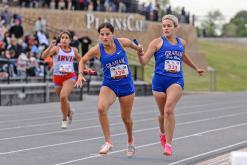 (DAVID FLYNN | CONTRIBUTED PHOTO) Kaden Atwood (right) passes the baton to teammate Georgia Martin (left) during one of the relay races at the regional meet in Lubbock. The Lady Blues’ relay teams finished sixth in the preliminaries in each of their races.